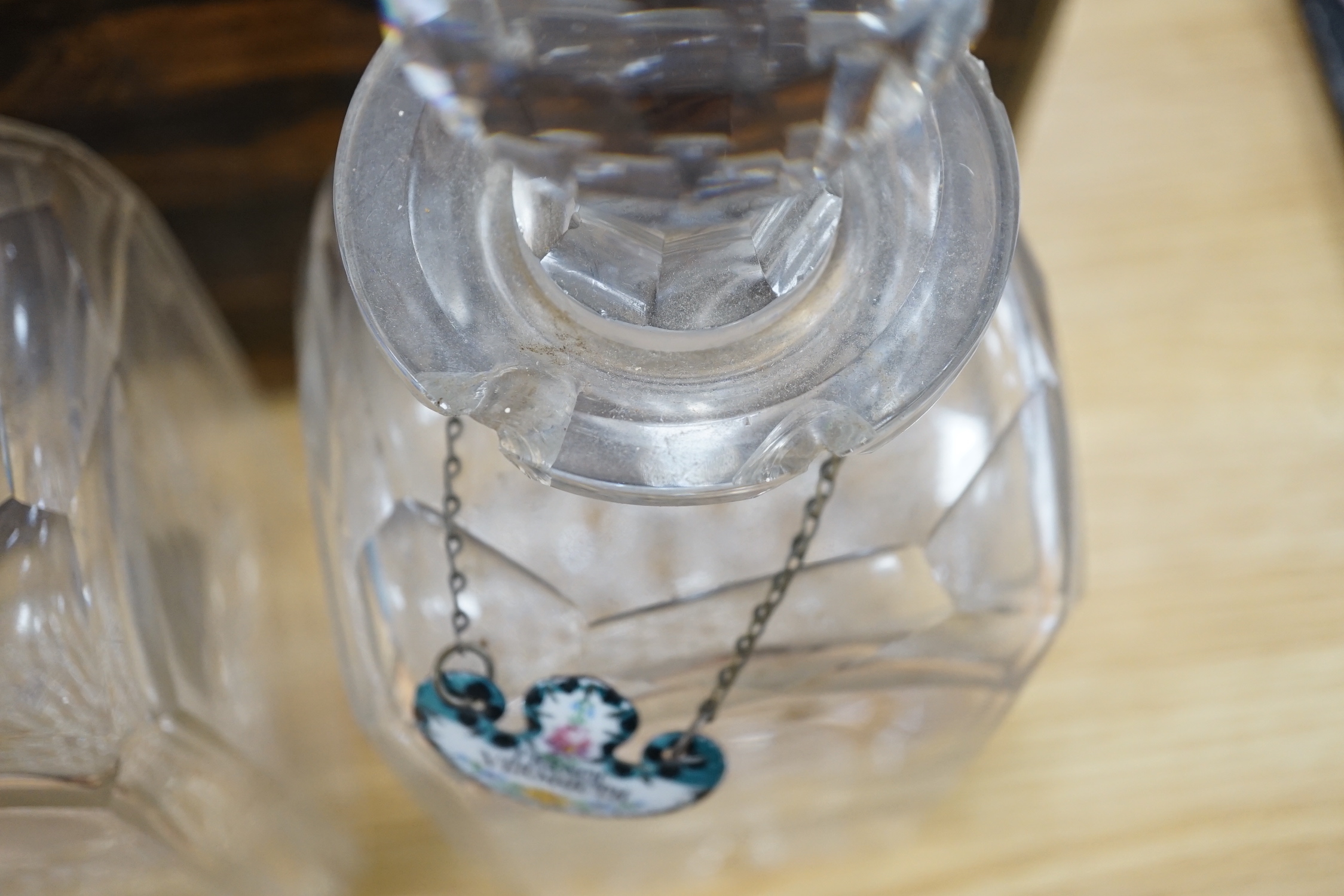 A Victorian coromandel four bottle decanter box with Bramah lock, three silver ‘hunting’ spirit labels and another enamelled, height of box 30cm